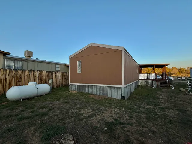 a view of a roof deck with furniture