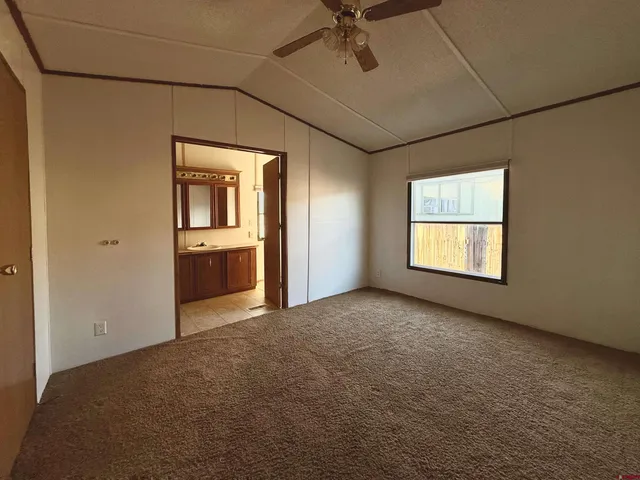 an empty room with a empty space and windows