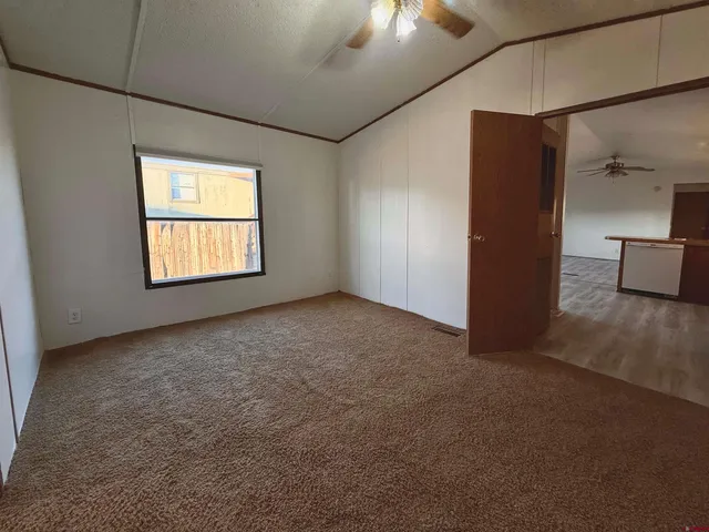 a bathroom with a sink a toilet and shower a mirror