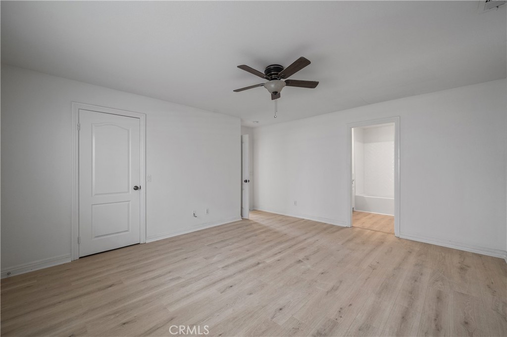 29582 Toomas Circle Menifee, CA 92587 - Photo 16 of 30 a view of empty room with wooden floor