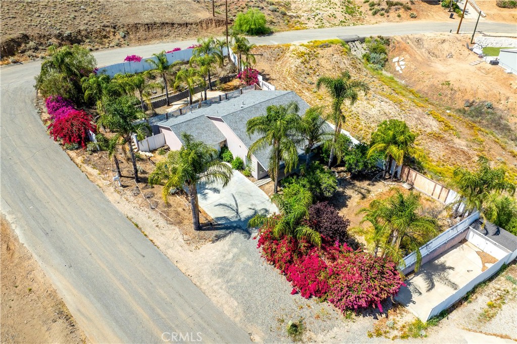 29582 Toomas Circle Menifee, CA 92587 - Photo 2 of 30 a vase of flowers sitting on a wooden floor