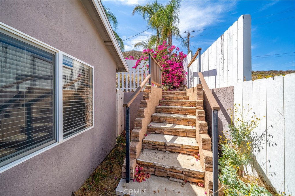 29582 Toomas Circle Menifee, CA 92587 - Photo 21 of 30 a view of entryway with flower pots