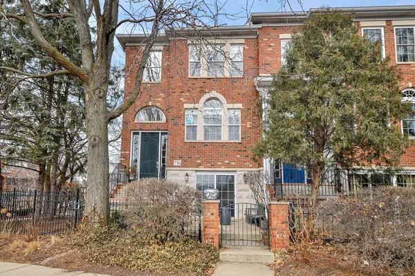 a front view of a residential houses with yard