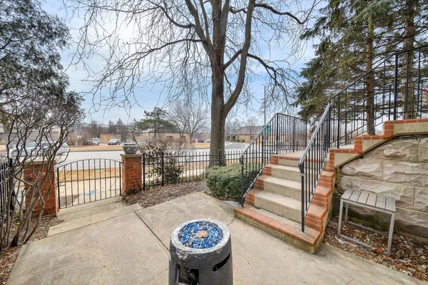 a view of a chairs and table in backyard