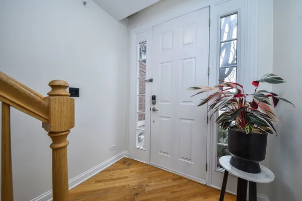 a view of a livingroom with furniture and hardwood floor