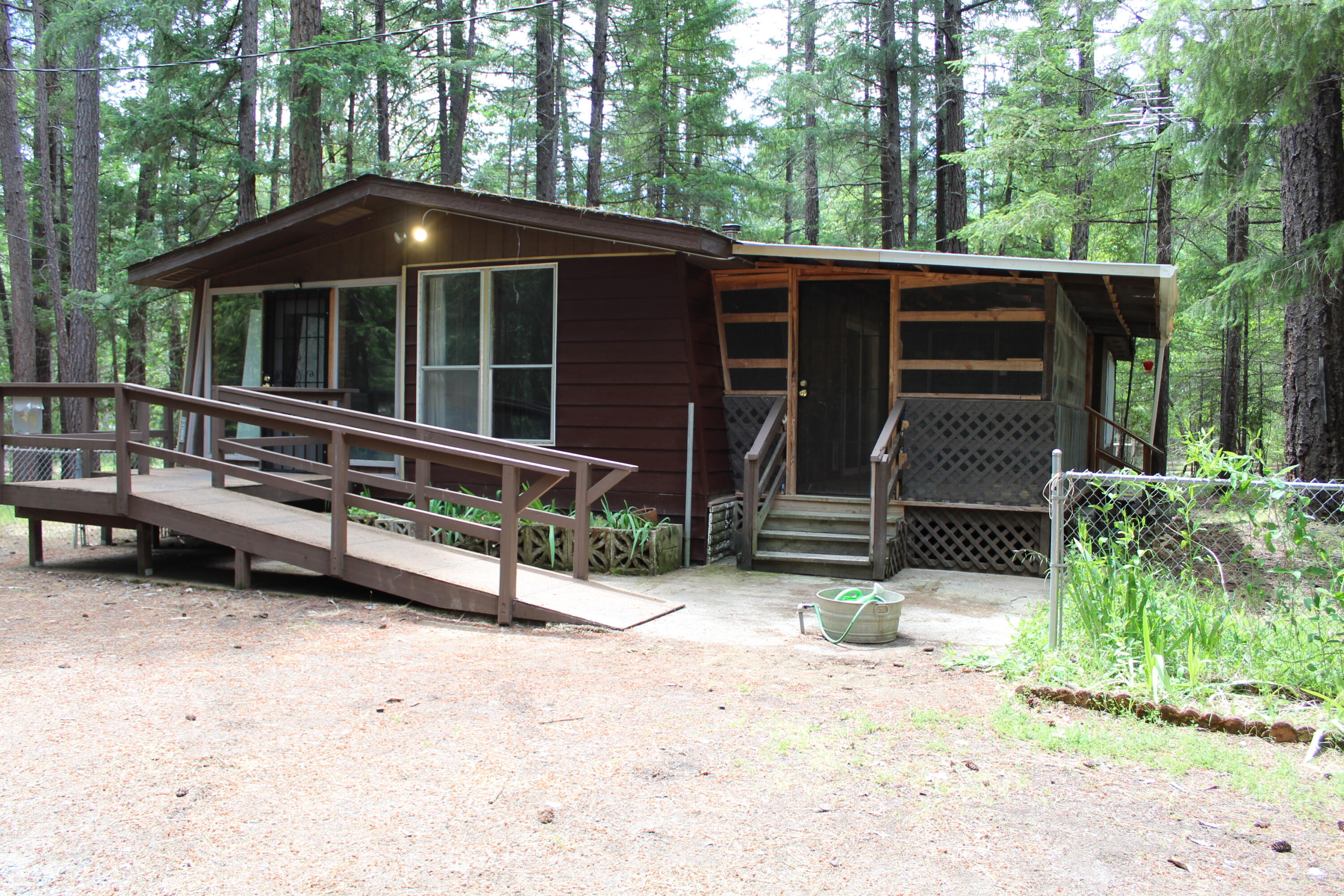 820 Queens Branch Road Rogue River, OR 97537 - Photo 1 of 32 a view of a house with a yard and sitting area