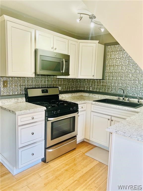 412 Lafayette Avenue, Unit 3 Buffalo, NY 14213 - Photo 2 of 9 kitchen, with microwave and stove