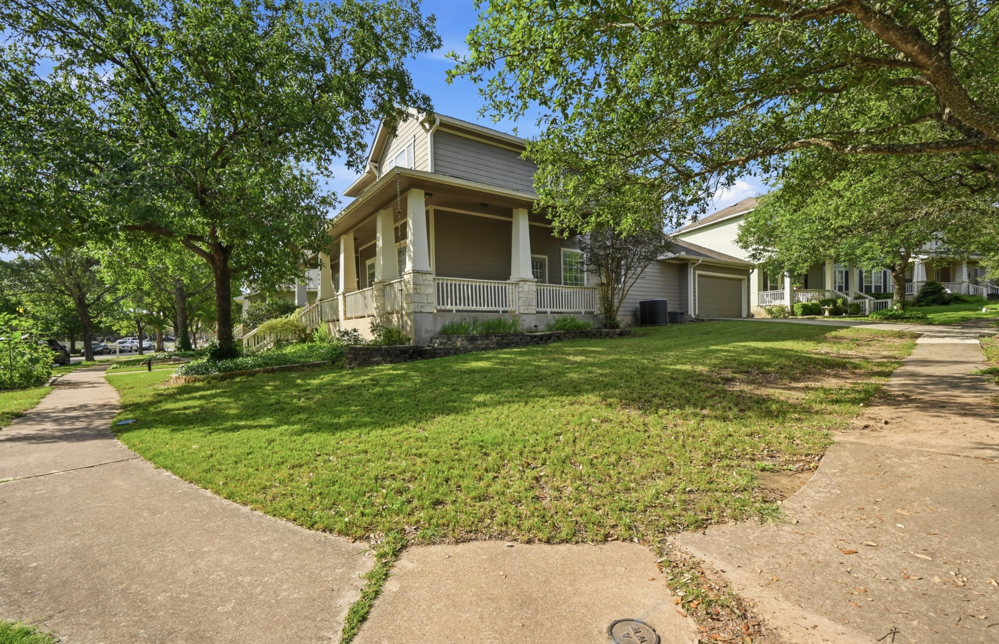 5888 Fergus Kyle, TX 78640 - Photo 40 of 40 A classic facade with a welcoming covered porch, mature trees shading the well-maintained lawn.