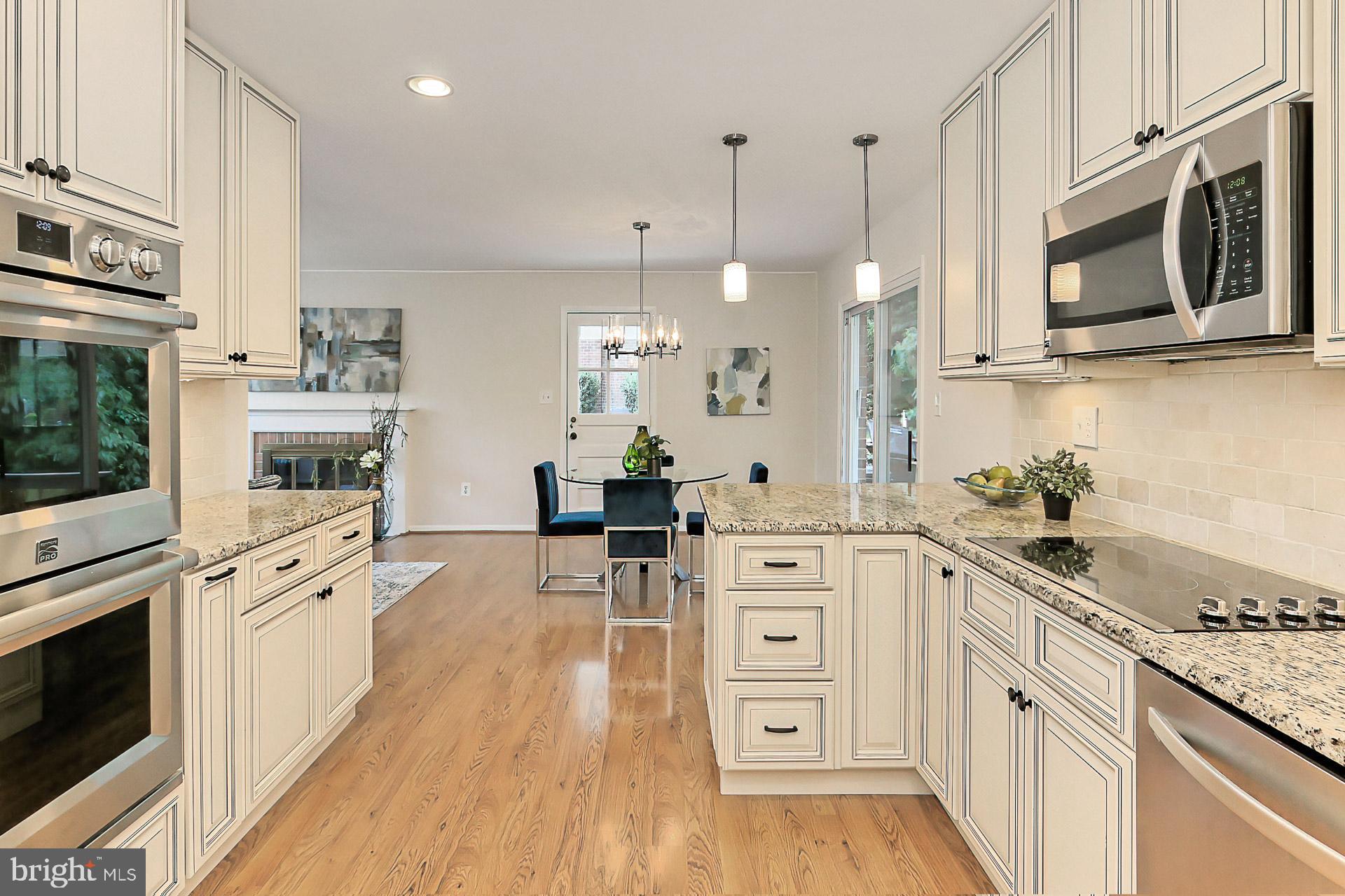 6808 Sydenstricker Road Springfield, VA 22153 - Photo 15 of 65 42 inch cabinets, granite, ceramic tile backsplash
