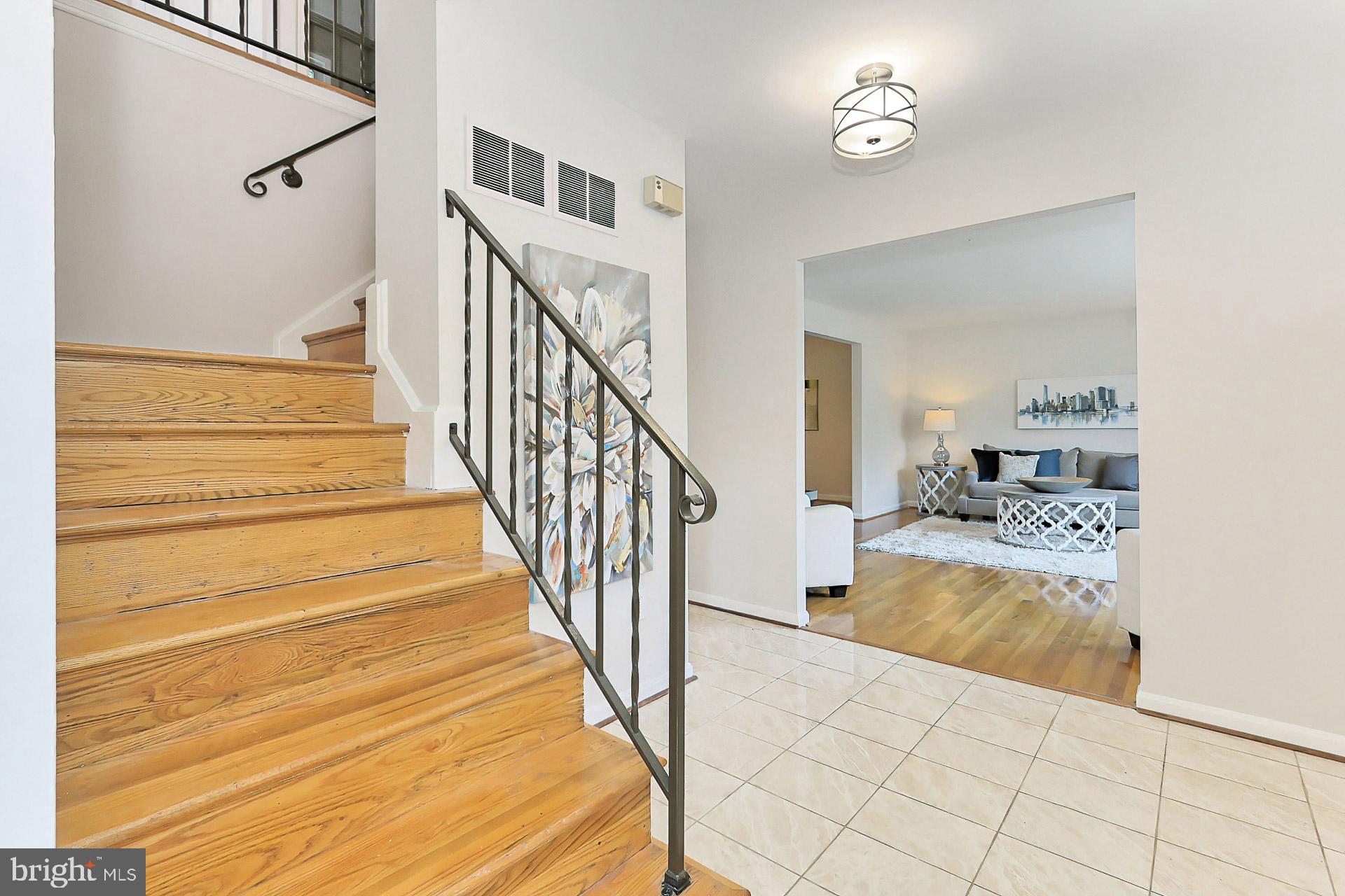 6808 Sydenstricker Road Springfield, VA 22153 - Photo 25 of 65 Foyer with new light fixture looking towards LR