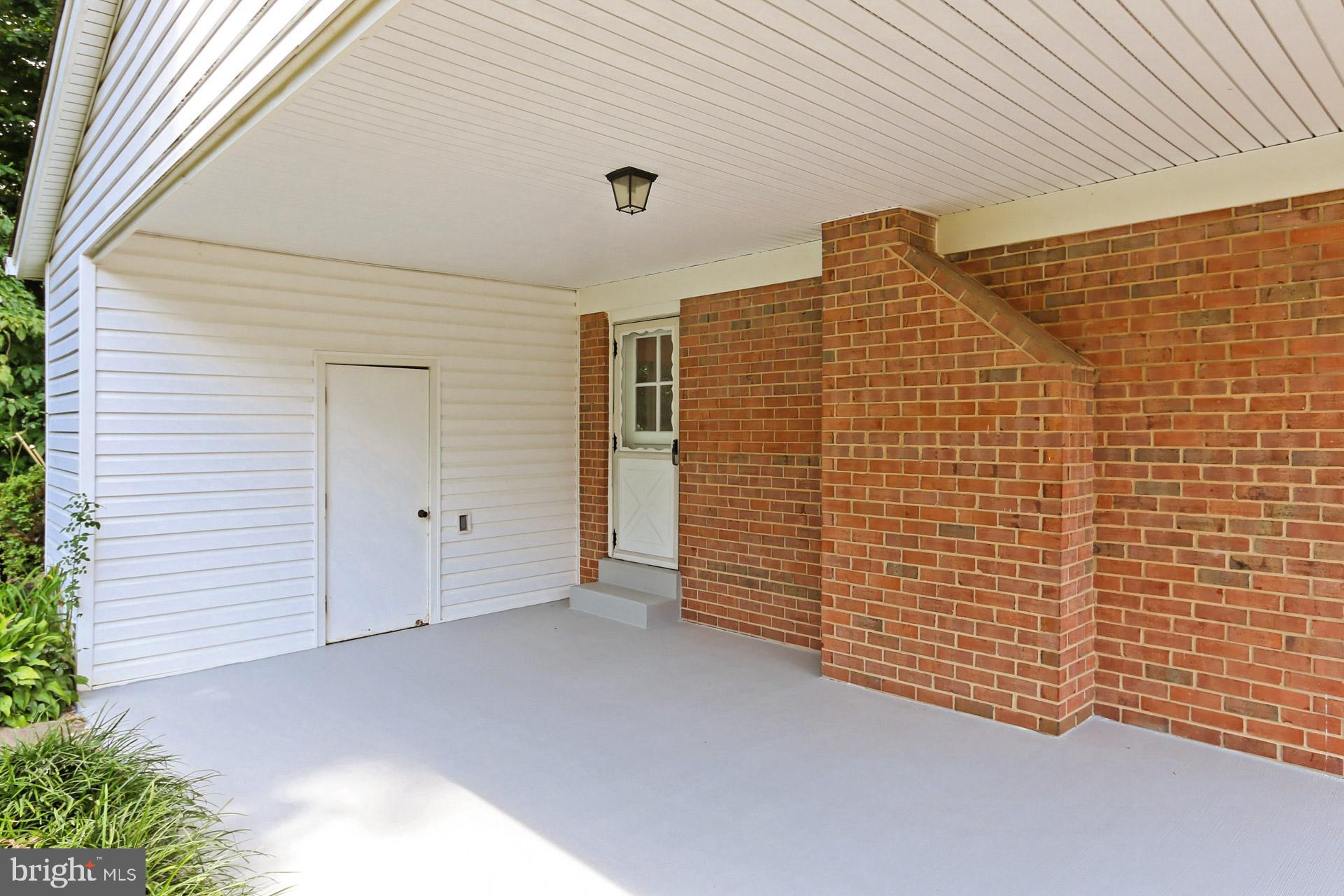 6808 Sydenstricker Road Springfield, VA 22153 - Photo 5 of 65 Carport with attached storage shed