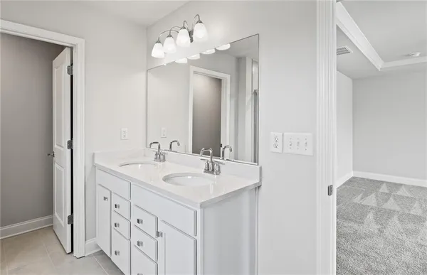 a bathroom with 2 sink and a mirror