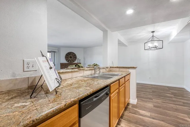 a kitchen with a sink a counter space and appliances