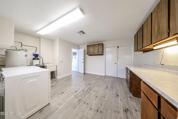 a view of storage and utility room with washer and dryer