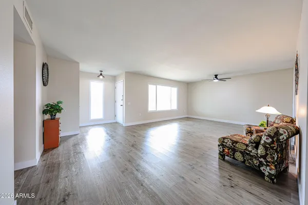 a bed room with furniture and wooden floor