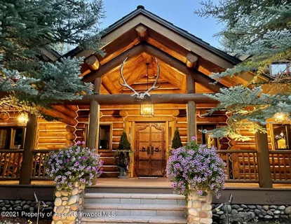 a view of a building with a tree front of house