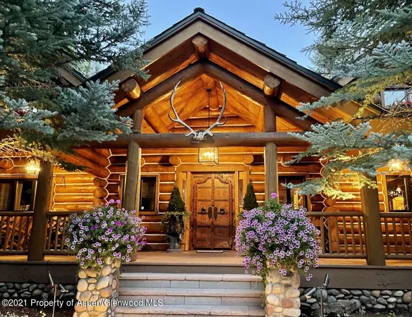 a view of a building with a tree front of house