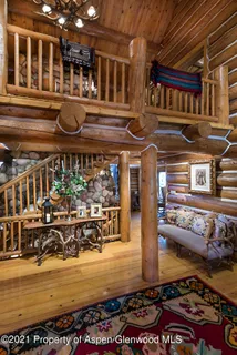 a kitchen with a stove a sink and cabinets