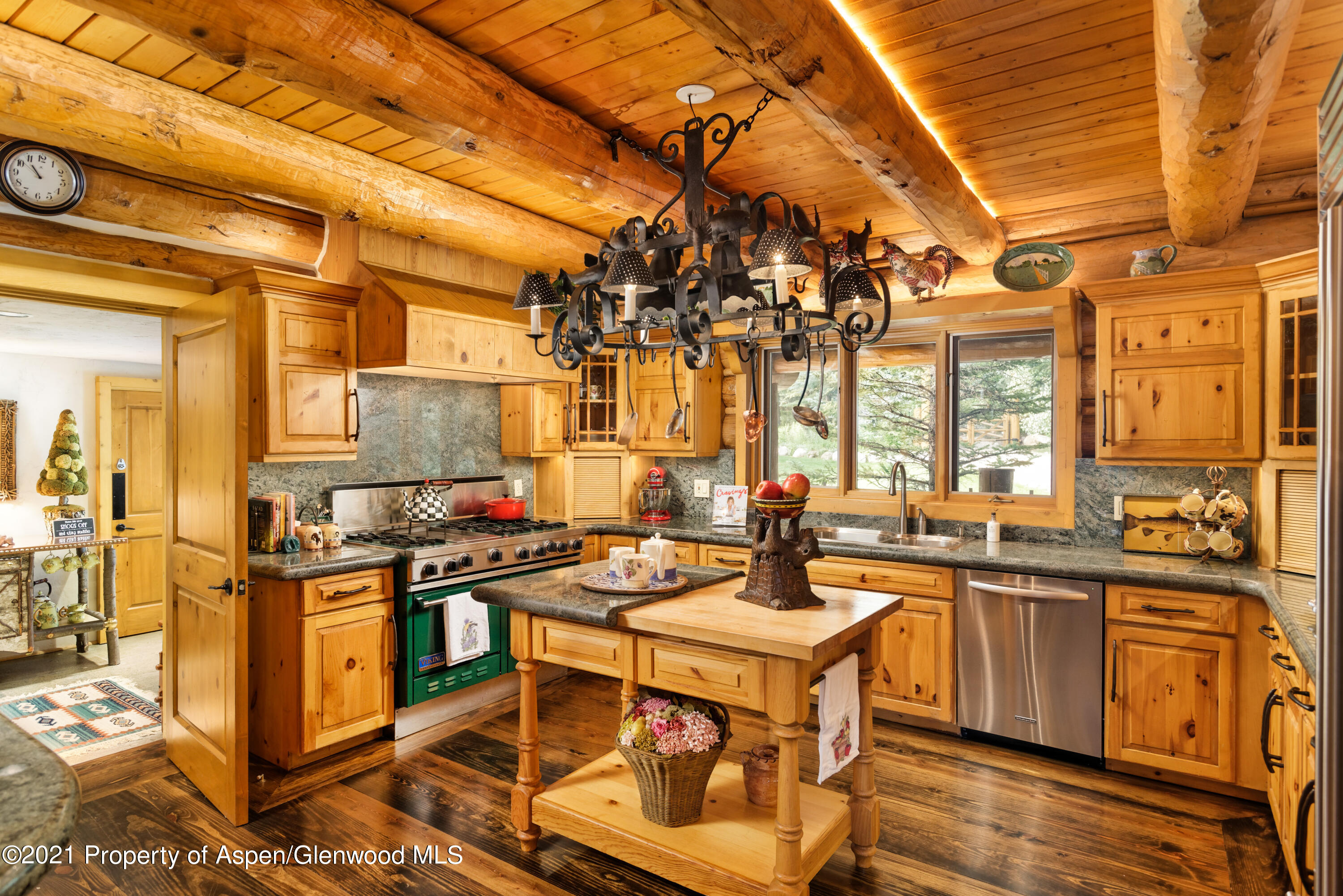 770 Twining Flats Road Woody Creek, CO 81611 - Photo 12 of 59 a kitchen with a stove a sink and cabinets