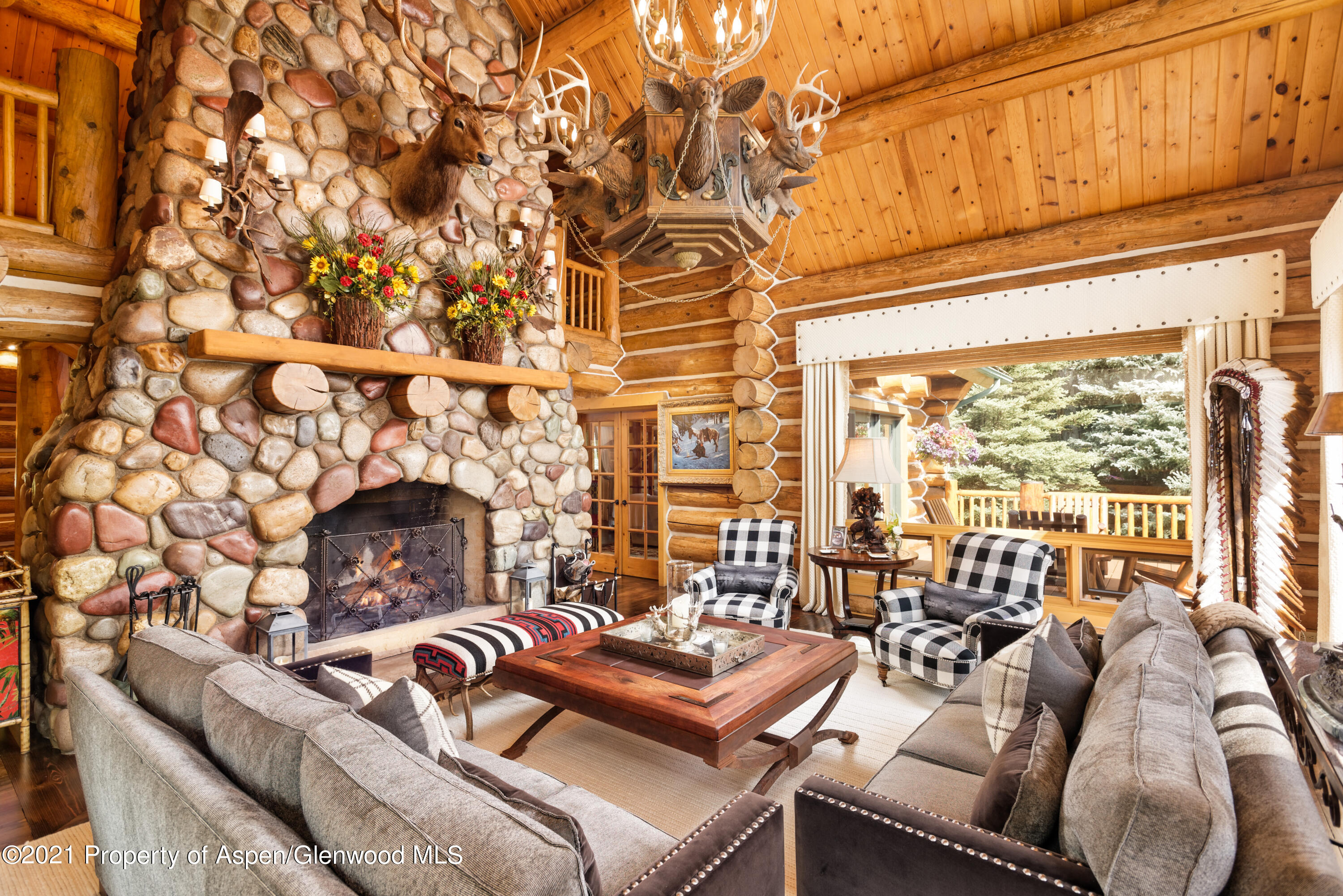 770 Twining Flats Road Woody Creek, CO 81611 - Photo 15 of 59 a living room with furniture and a large window