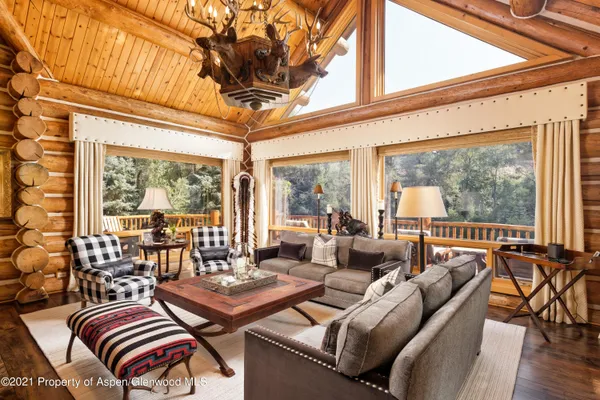 a view of a patio with table and chairs and potted plants