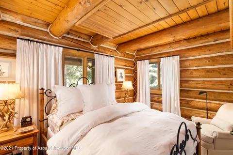 a living room with fireplace furniture and a fireplace