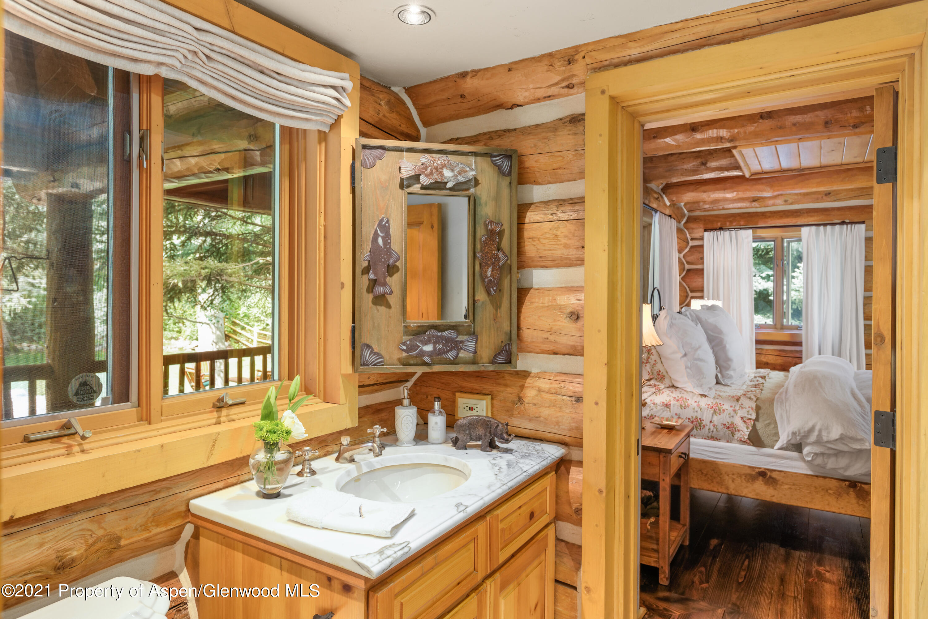 770 Twining Flats Road Woody Creek, CO 81611 - Photo 22 of 59 a bathroom with a sink and a mirror