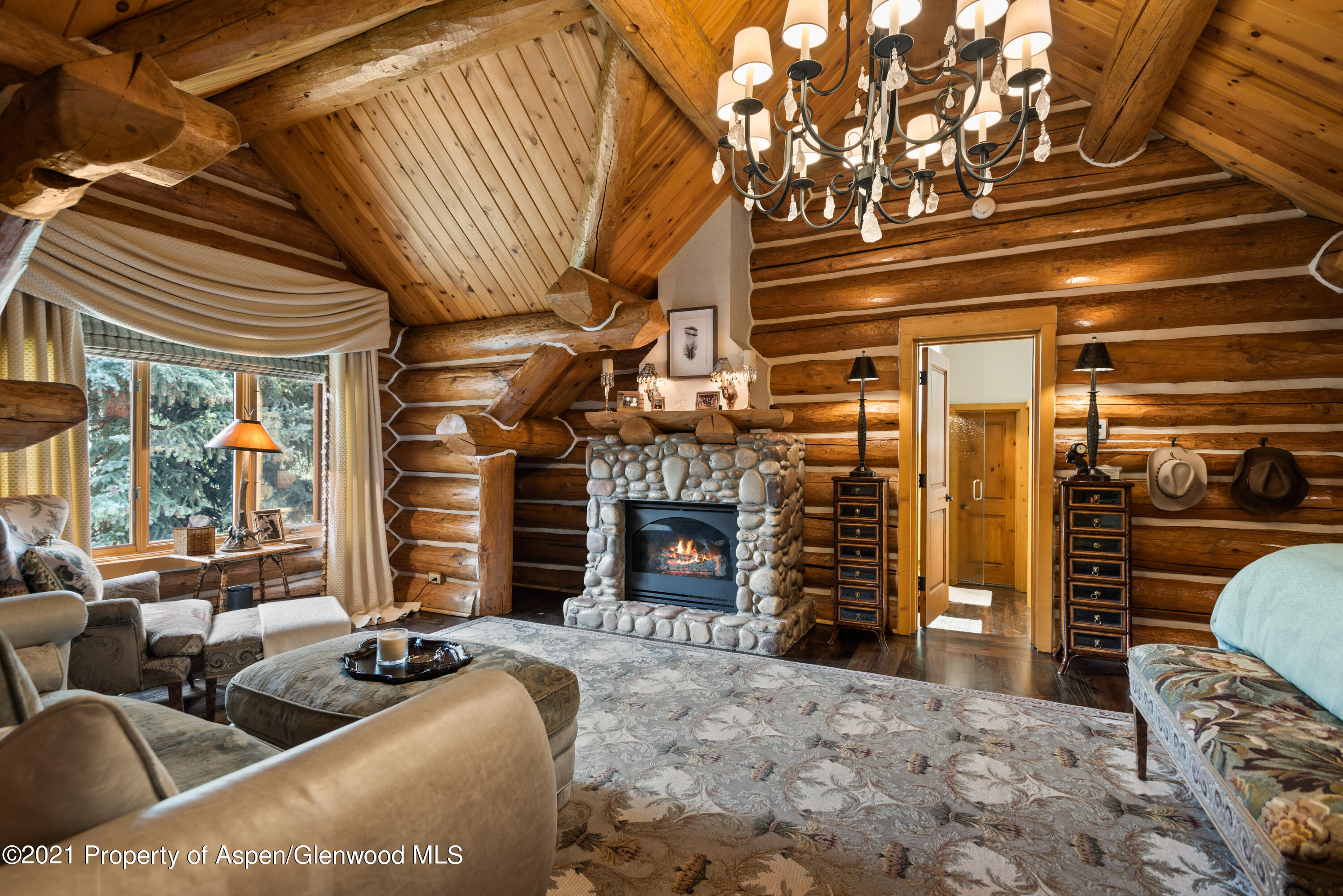 770 Twining Flats Road Woody Creek, CO 81611 - Photo 24 of 59 a living room with fireplace furniture and a fireplace