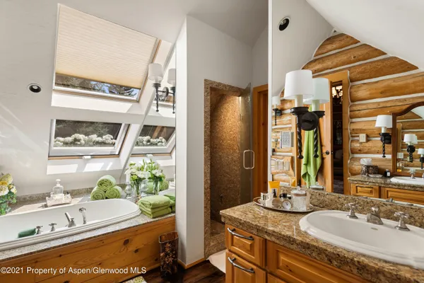 a bed room with a bed and a mirror