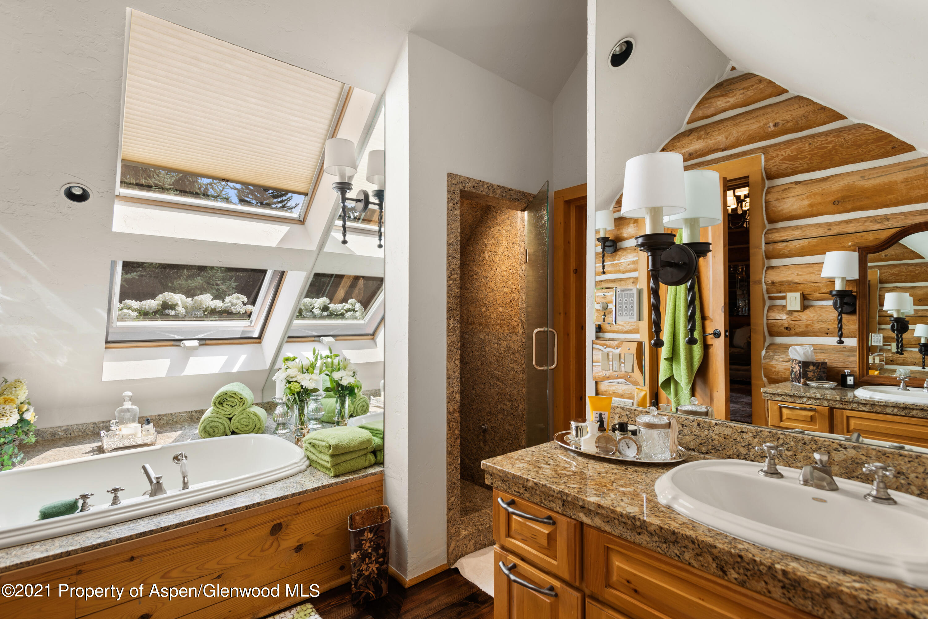 770 Twining Flats Road Woody Creek, CO 81611 - Photo 27 of 59 a bathroom with a granite countertop sink and a mirror