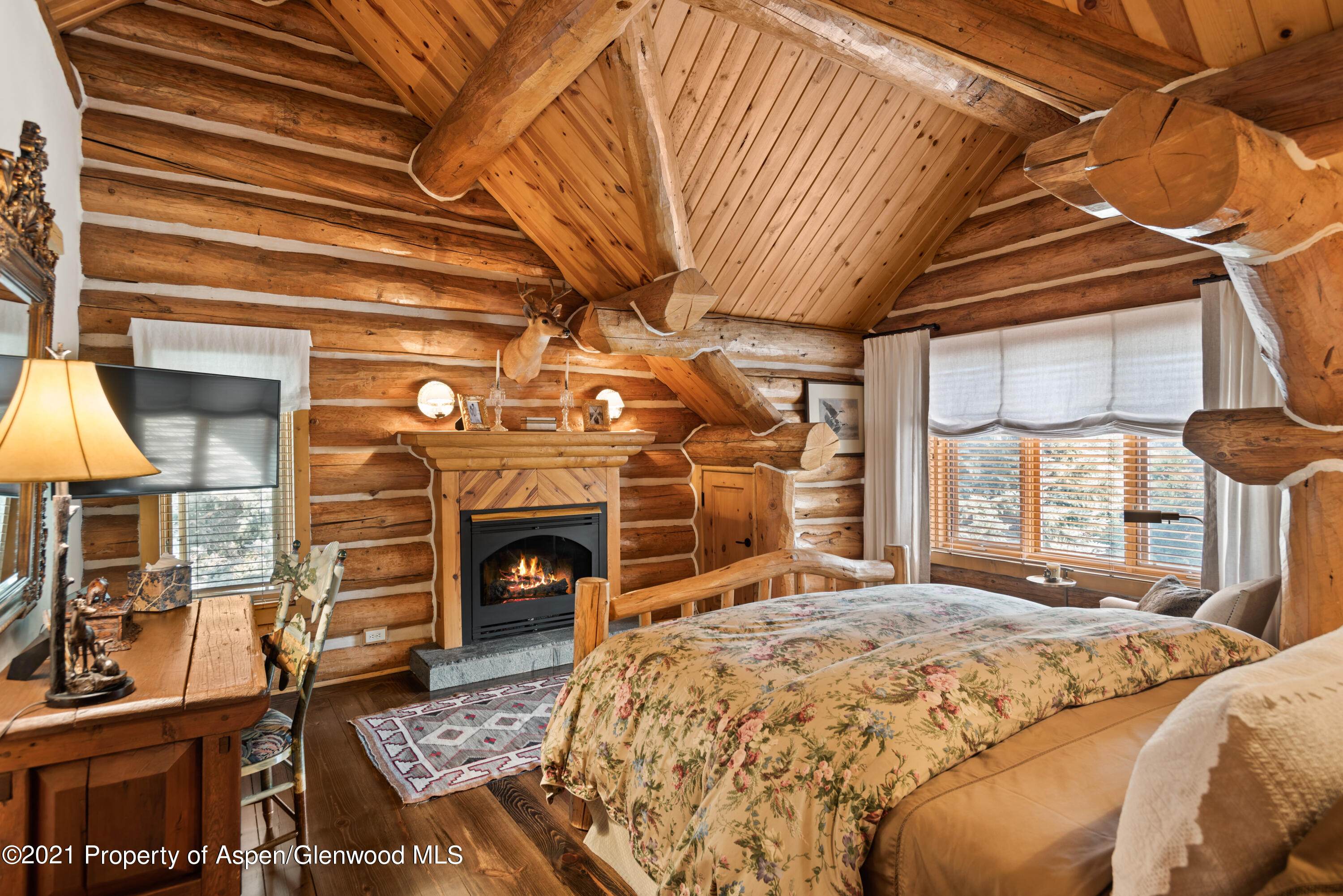 770 Twining Flats Road Woody Creek, CO 81611 - Photo 30 of 59 a bed sitting in a spacious bedroom next to a window