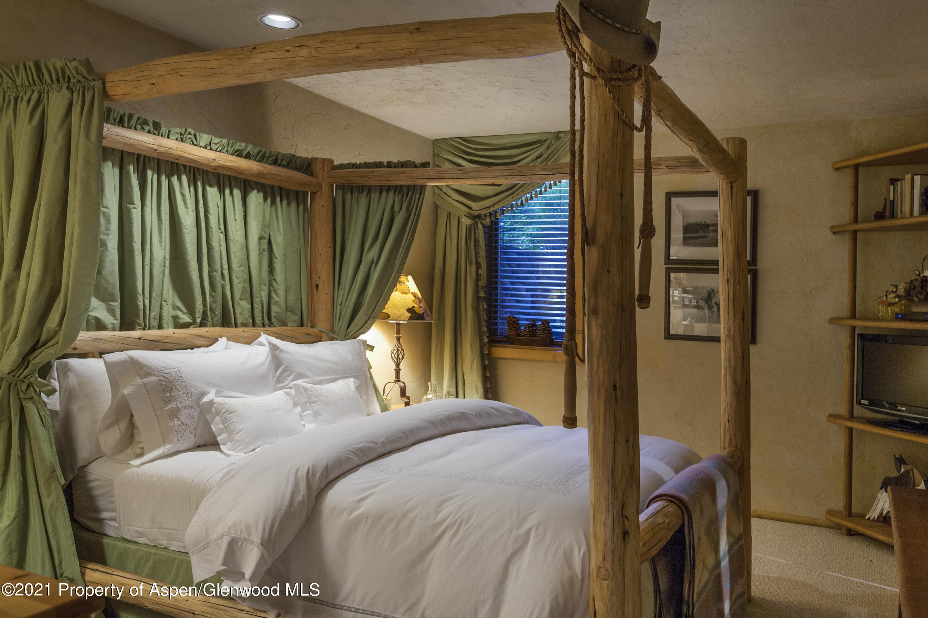 770 Twining Flats Road Woody Creek, CO 81611 - Photo 33 of 59 a bed room with a bed and a mirror