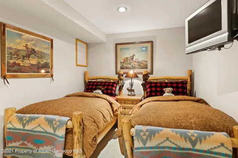 a room with furniture pool table and windows