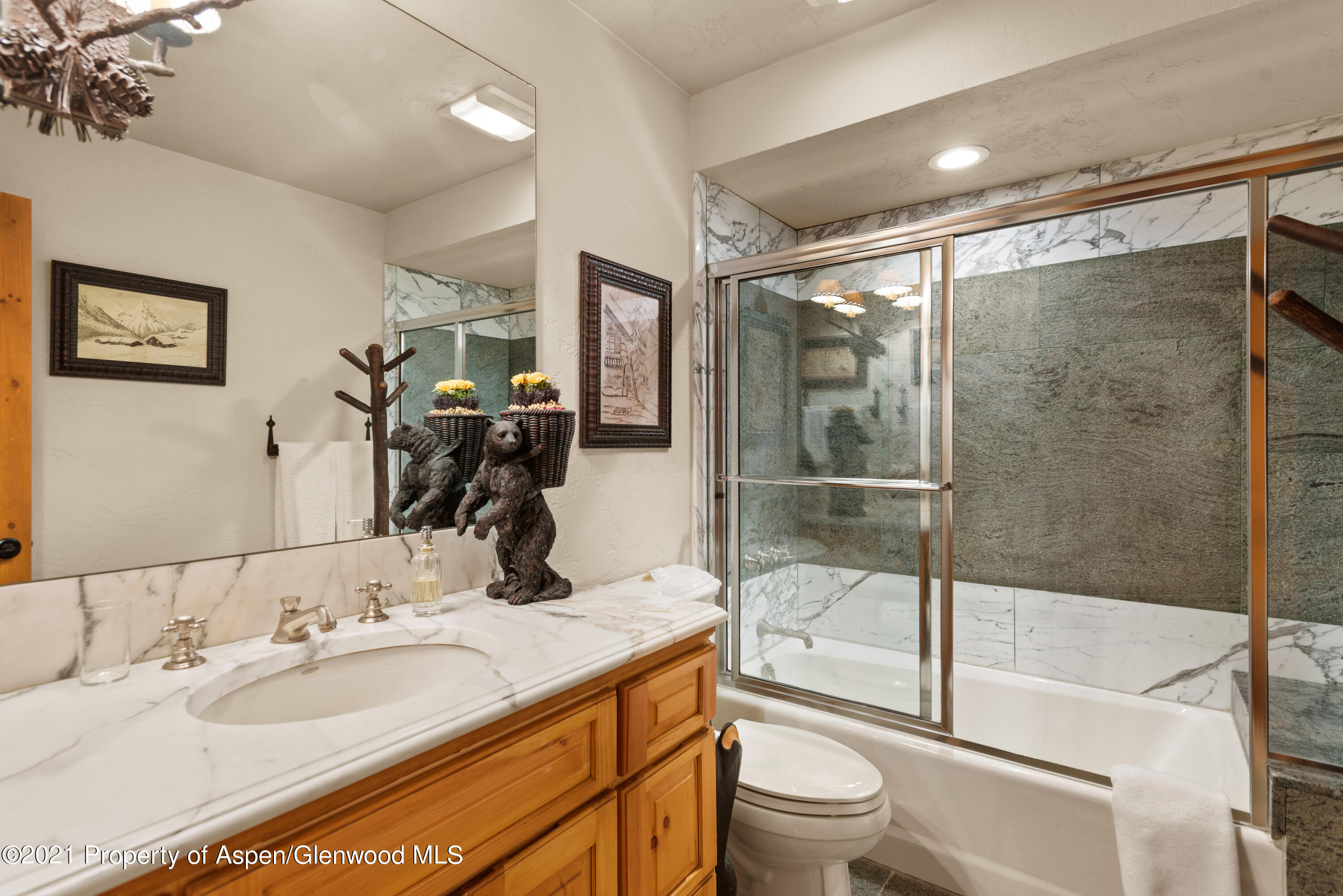770 Twining Flats Road Woody Creek, CO 81611 - Photo 36 of 59 a bathroom with a granite countertop sink toilet and shower
