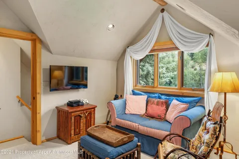 a view of a backyard with sitting area