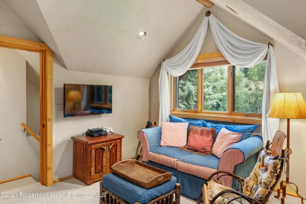 a view of a backyard with sitting area