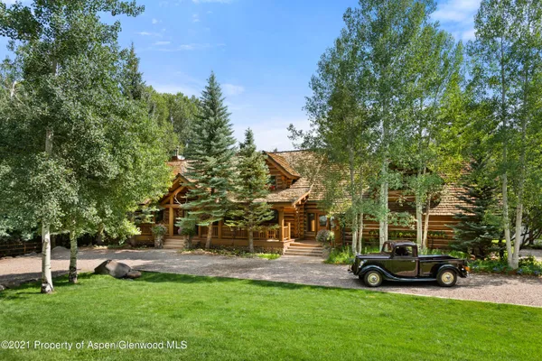 a view of a backyard with plants and a patio