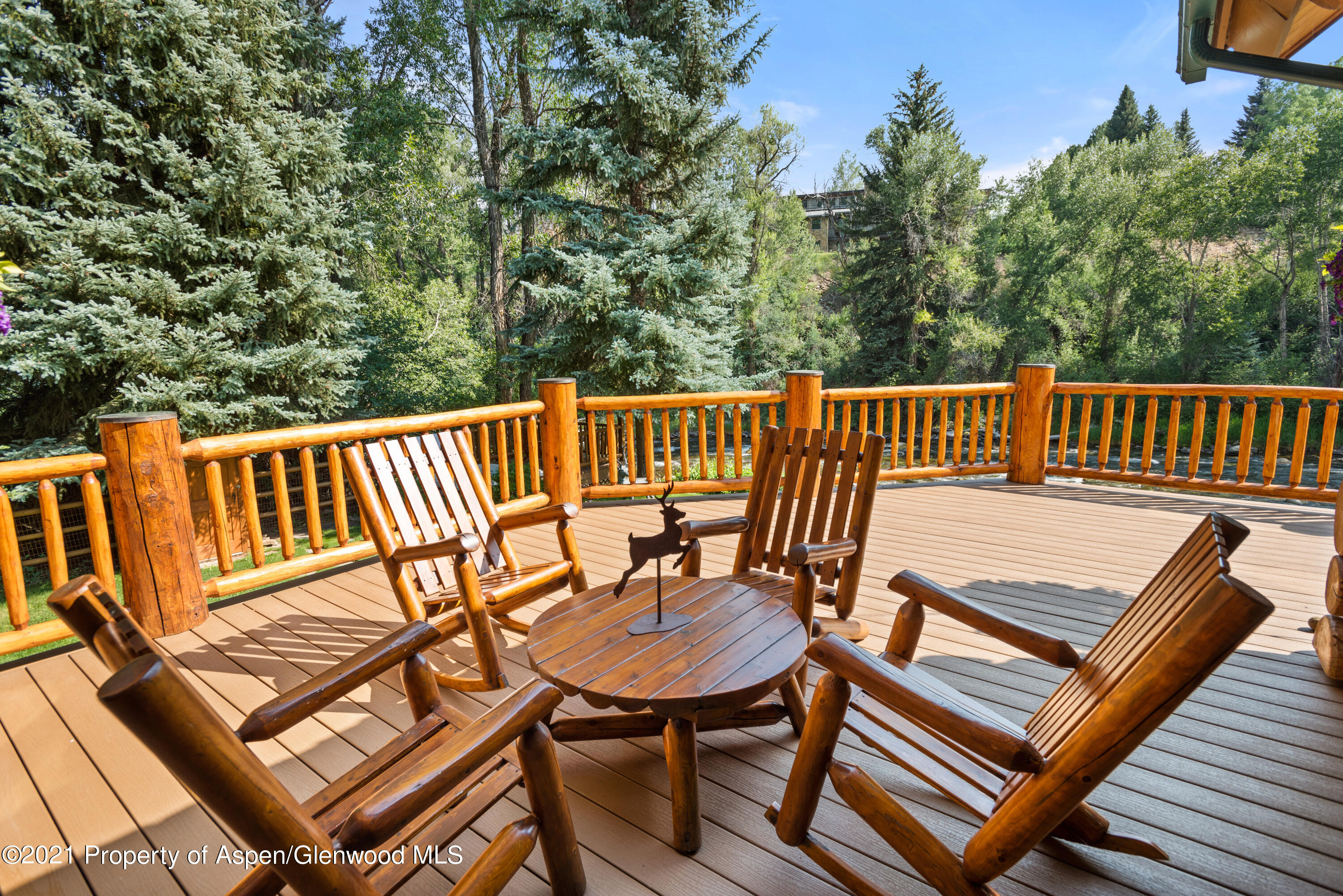 770 Twining Flats Road Woody Creek, CO 81611 - Photo 49 of 59 a view of a chairs in wooden deck