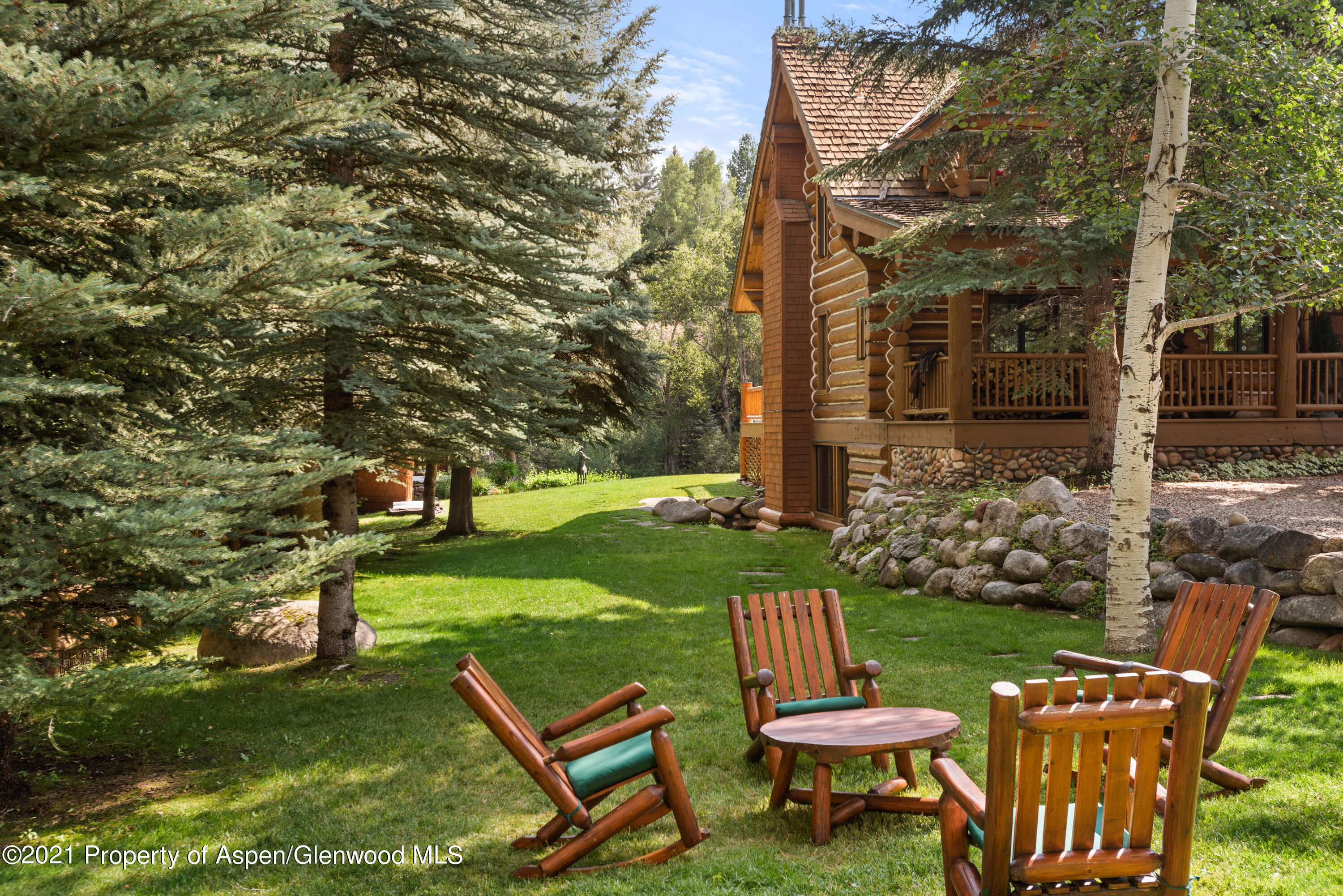 770 Twining Flats Road Woody Creek, CO 81611 - Photo 50 of 59 a view of a bench in the garden
