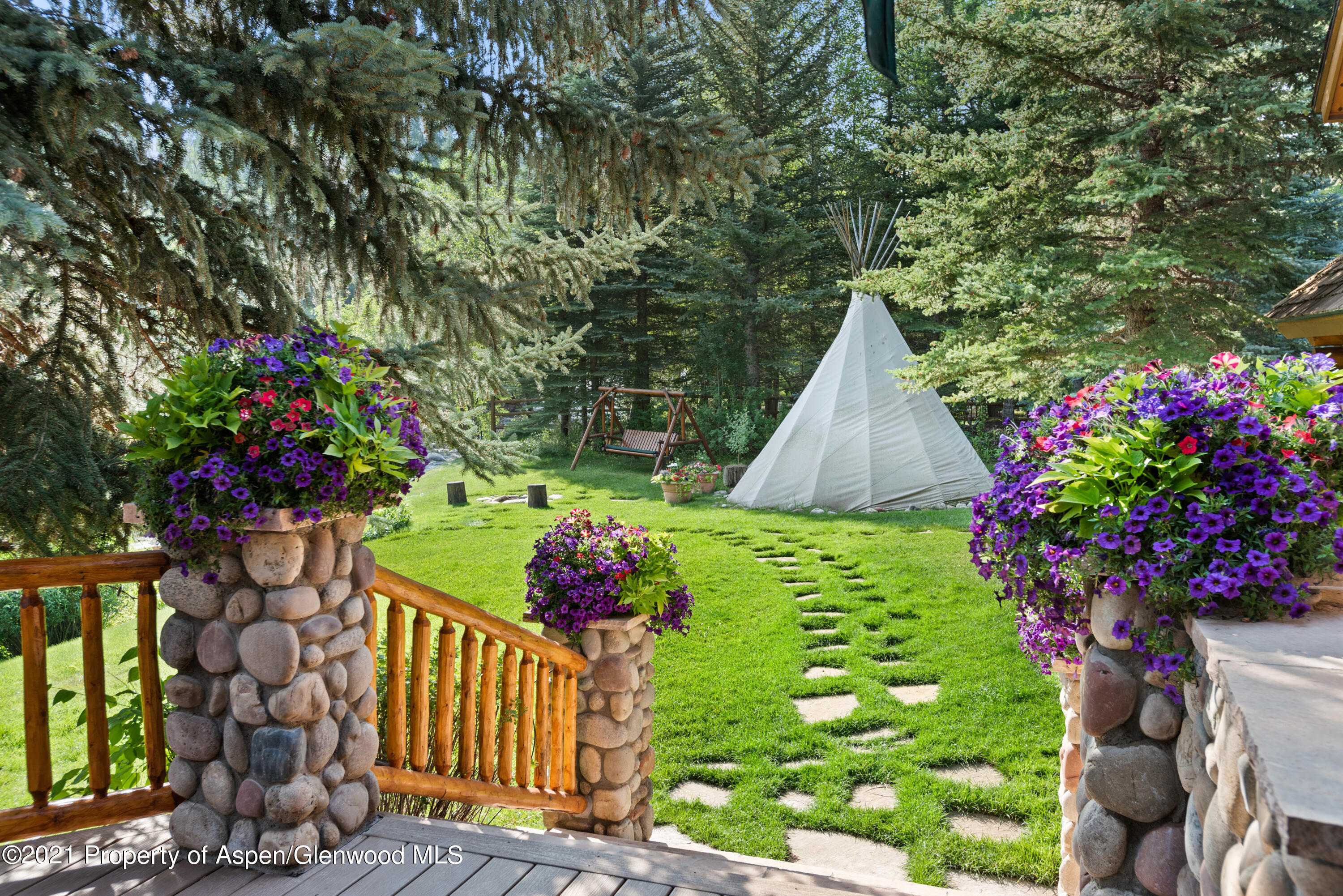 770 Twining Flats Road Woody Creek, CO 81611 - Photo 7 of 59 a view of a backyard with plants