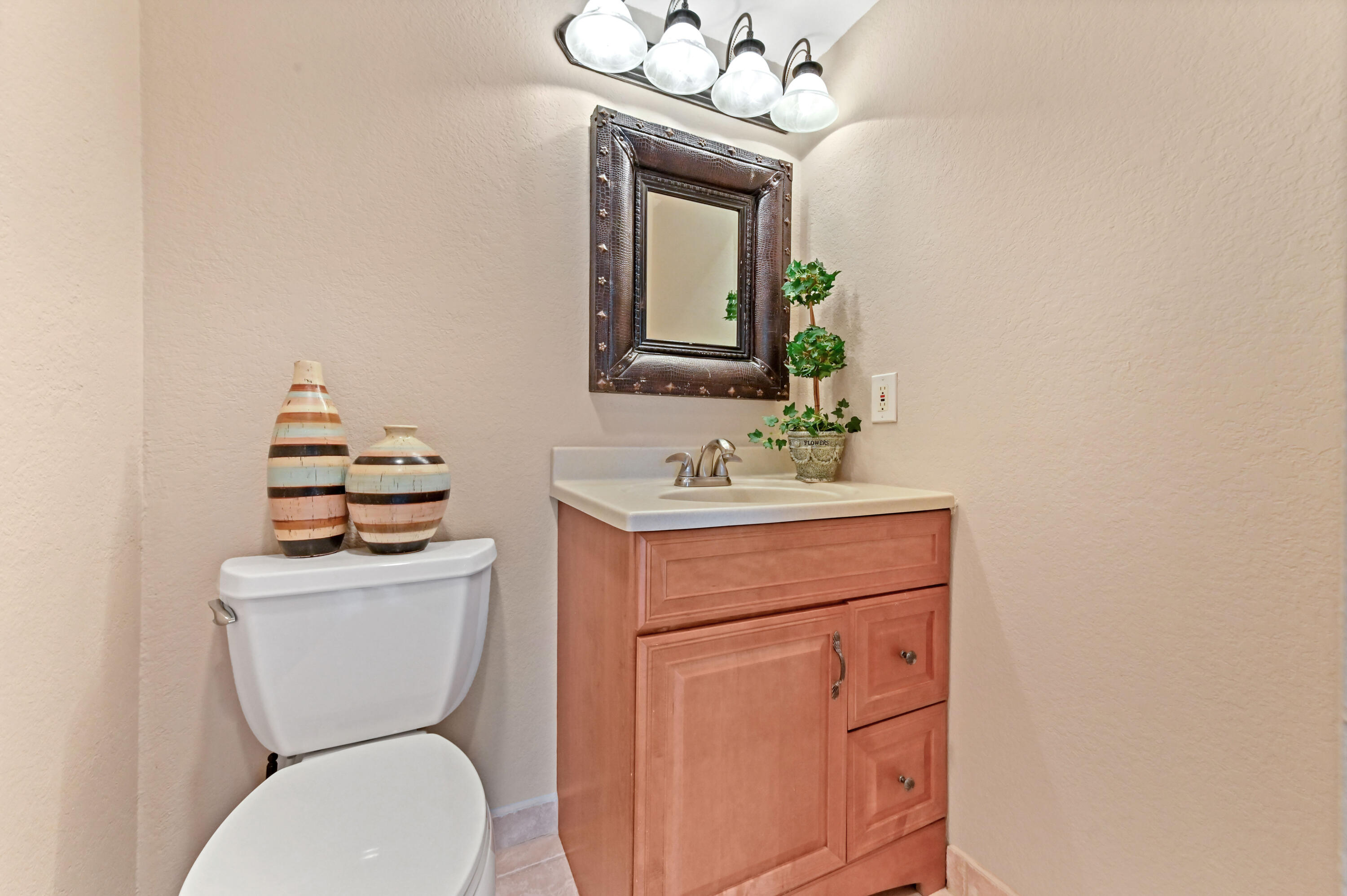 262 Monaco Way Delray Beach, FL 33446 - Photo 14 of 30 a bathroom with a toilet a sink and mirror