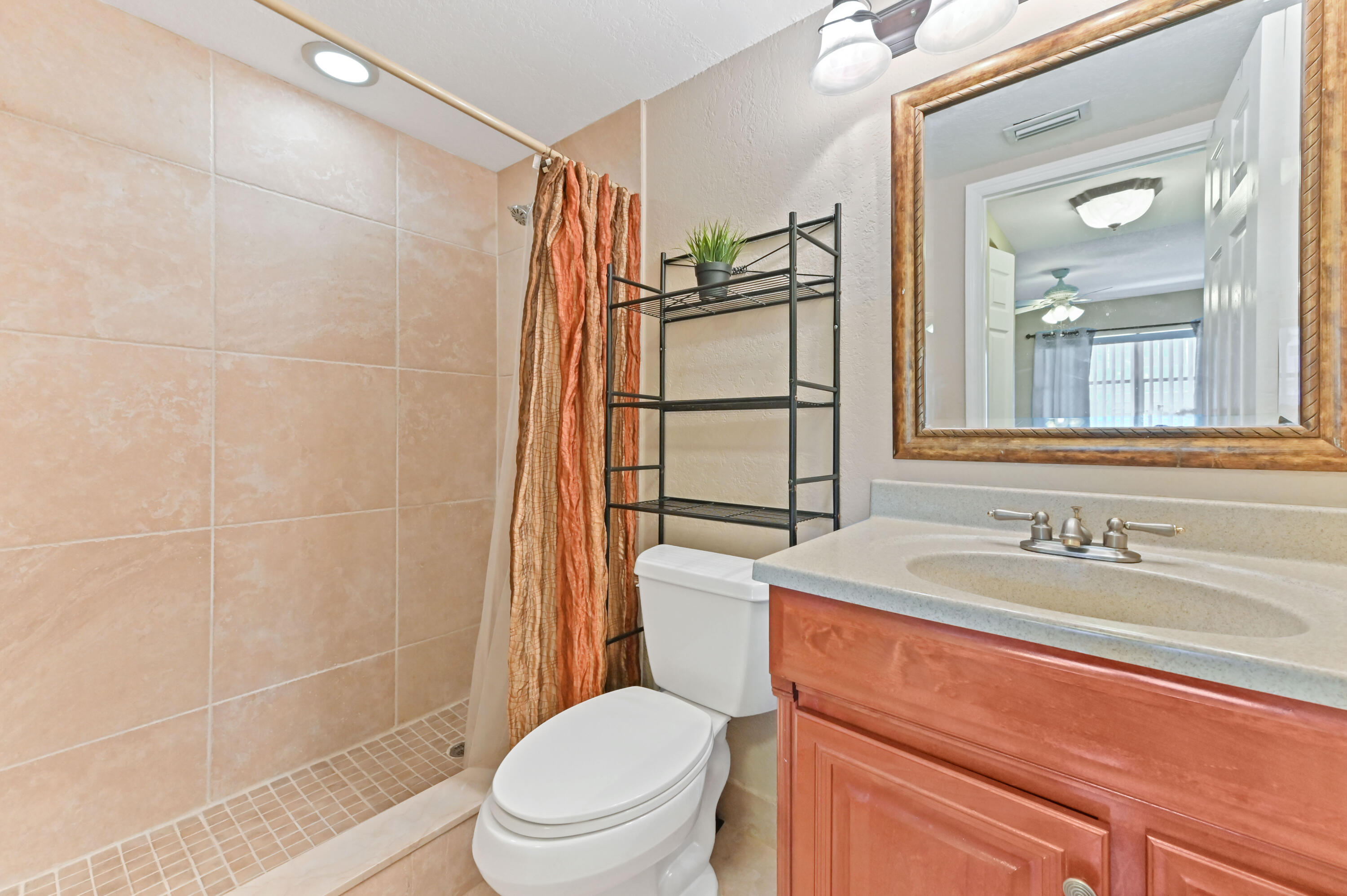 262 Monaco Way Delray Beach, FL 33446 - Photo 17 of 30 a bathroom with a sink toilet and shower