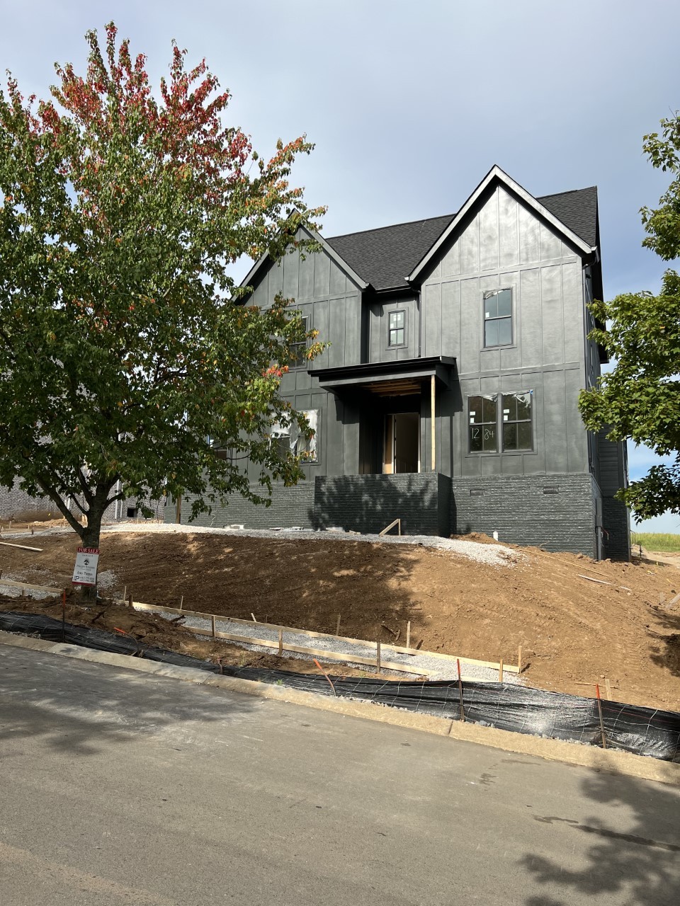 131 Alfred Ladd Road Franklin, TN 37064 - Photo 2 of 34 a front view of a house with a yard and garage