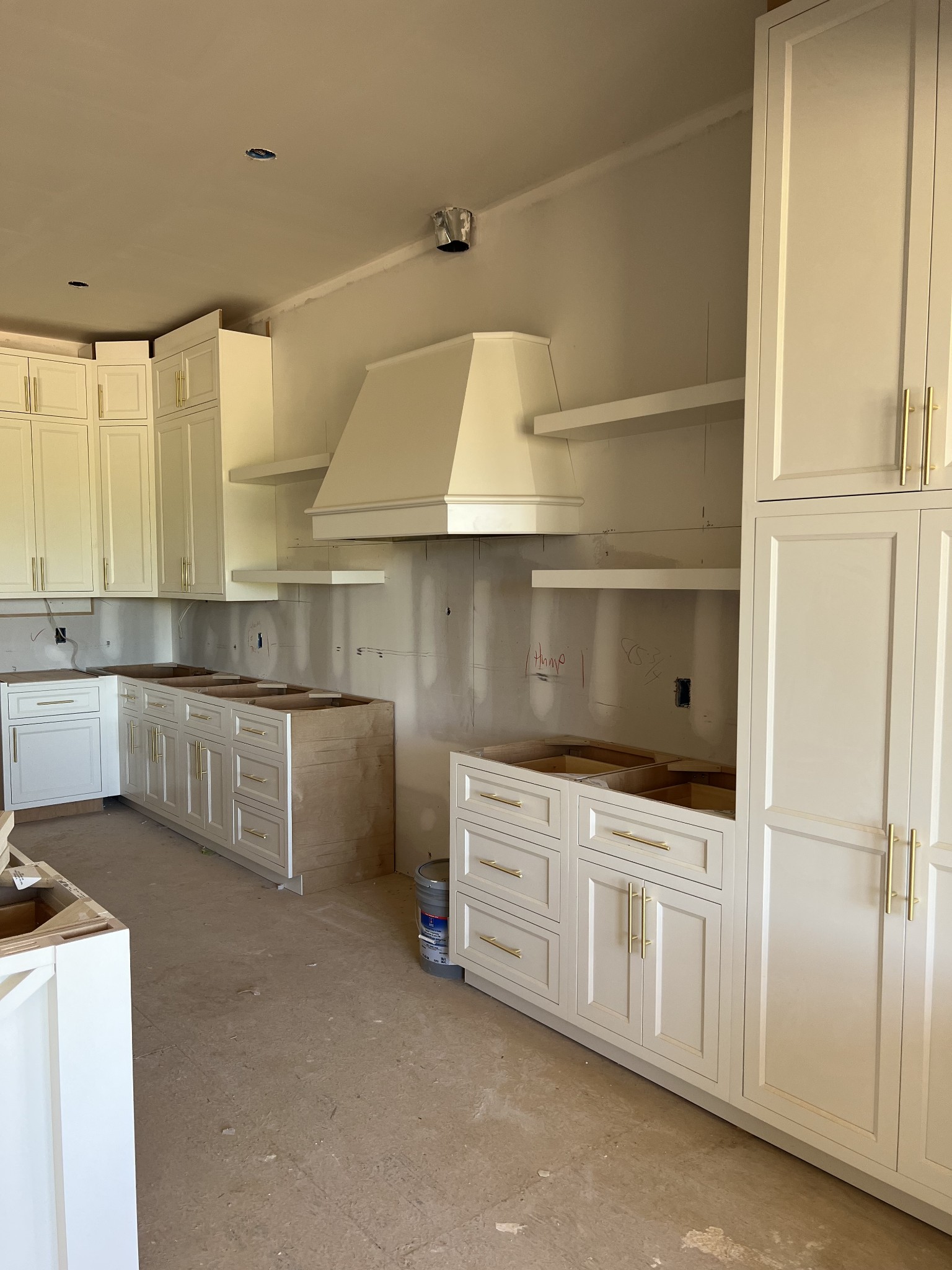 131 Alfred Ladd Road Franklin, TN 37064 - Photo 5 of 34 a kitchen with white cabinets and white appliances