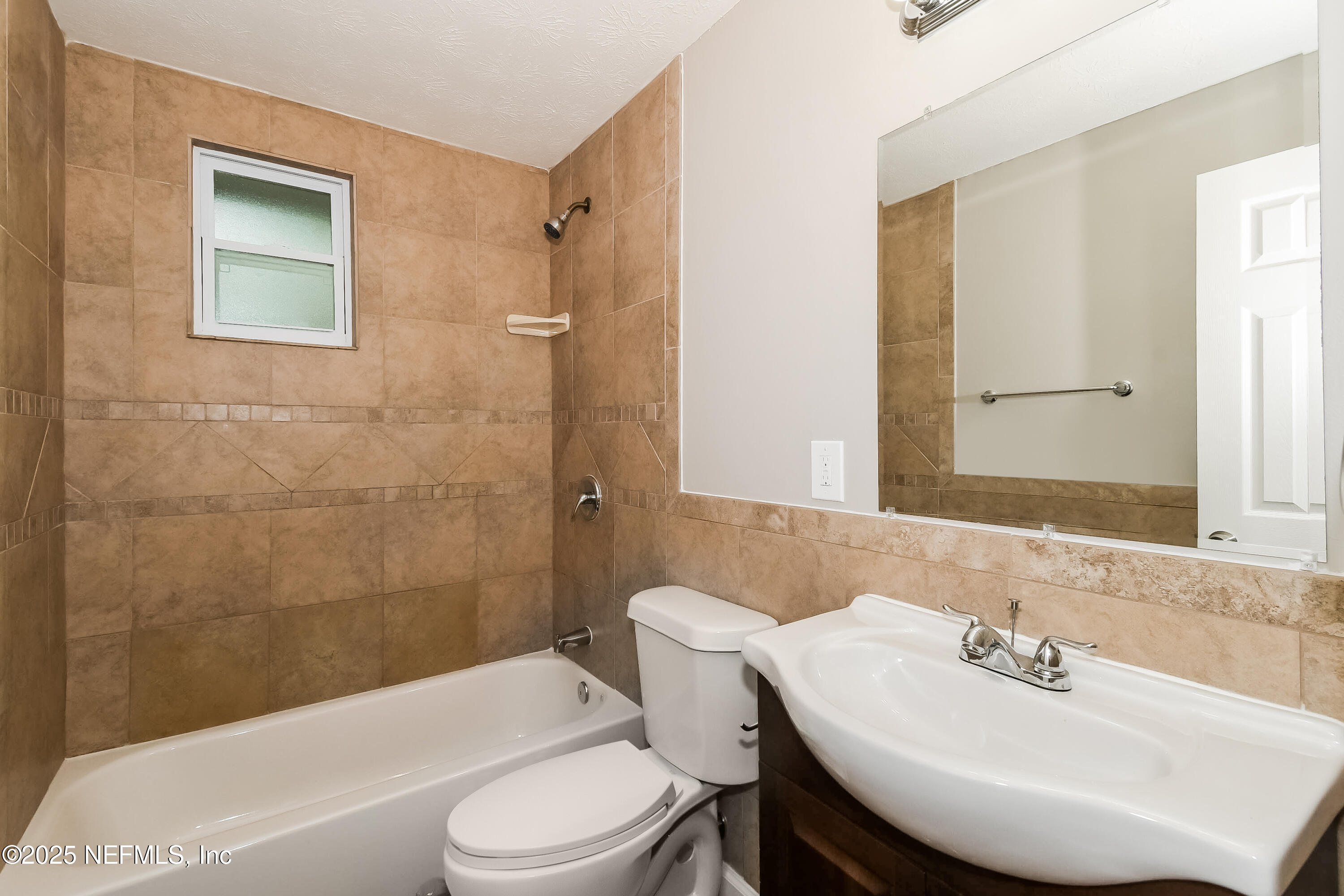 10632 Pinholster Road Jacksonville, FL 32218 - Photo 14 of 15 a bathroom with a sink a toilet and shower