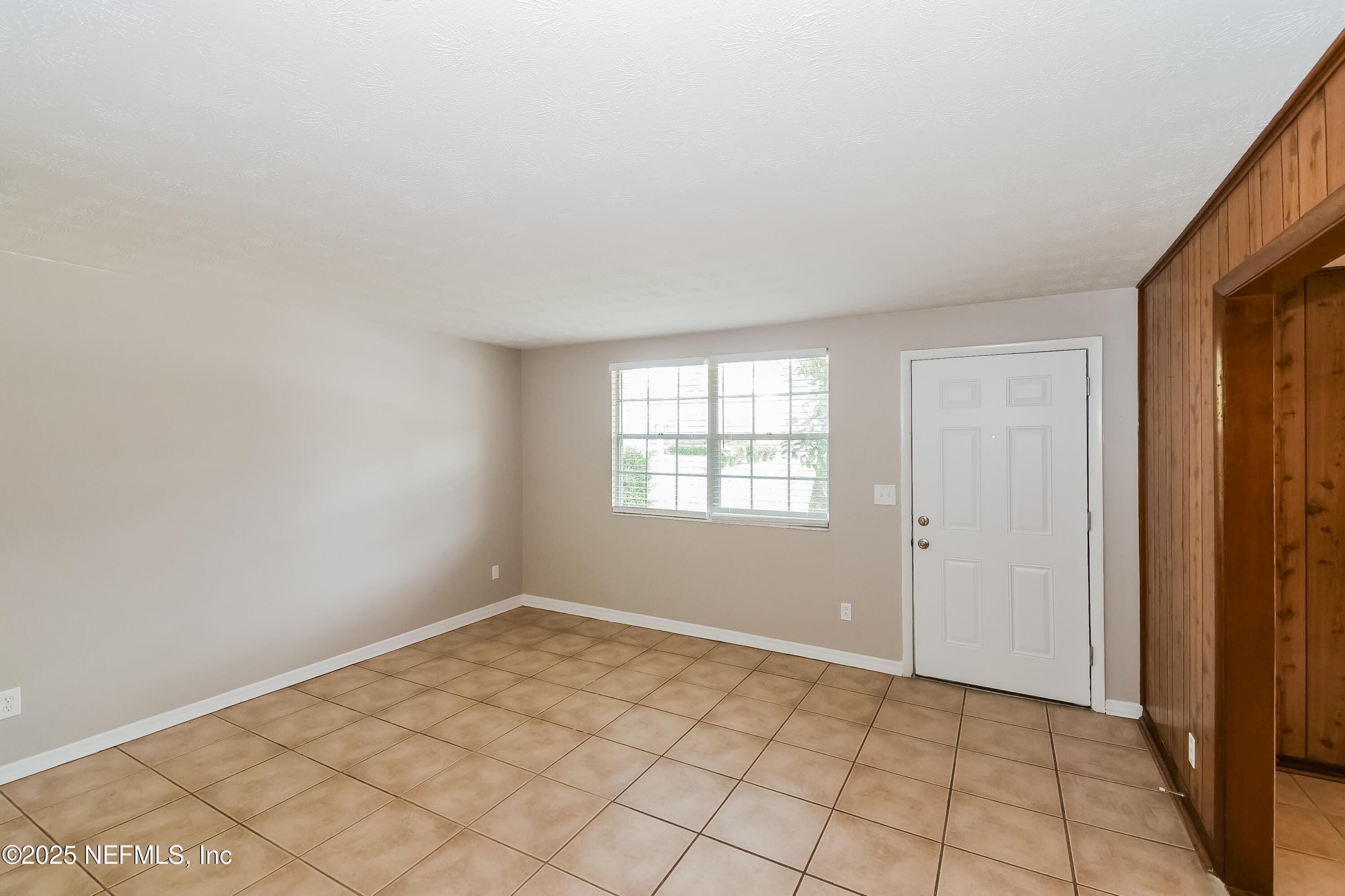 10632 Pinholster Road Jacksonville, FL 32218 - Photo 2 of 15 a view of an empty room and window