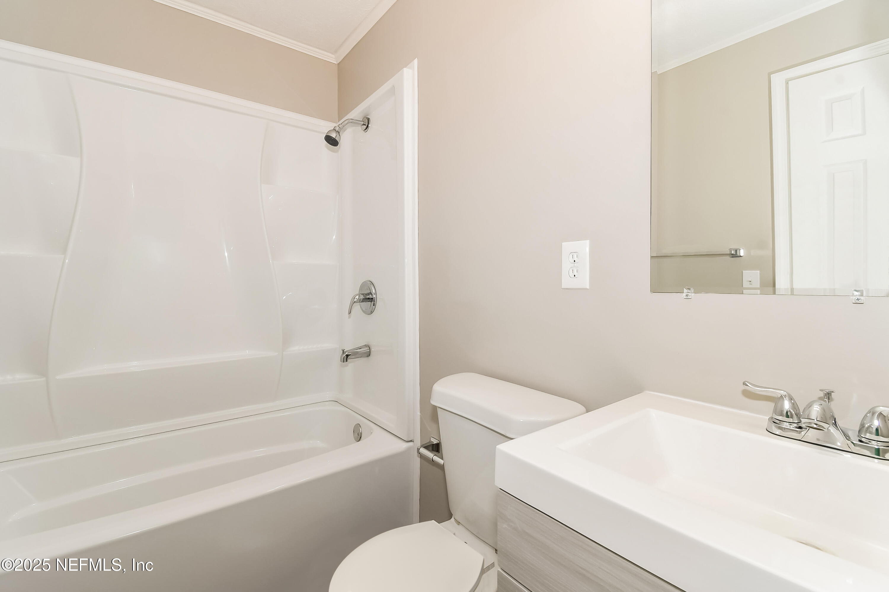 10632 Pinholster Road Jacksonville, FL 32218 - Photo 9 of 15 a white toilet sitting next to a bath tub