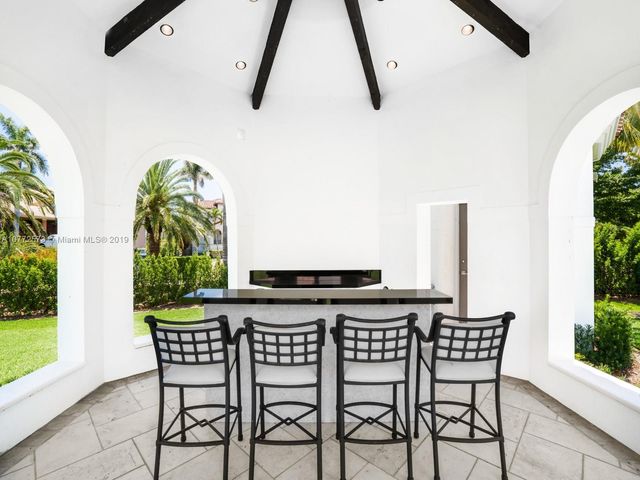a view of a dining room with furniture and a potted plant