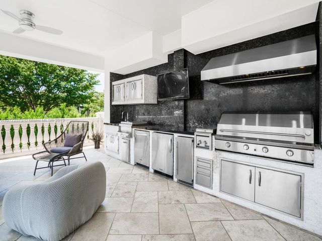 a kitchen with a stove a sink and a refrigerator
