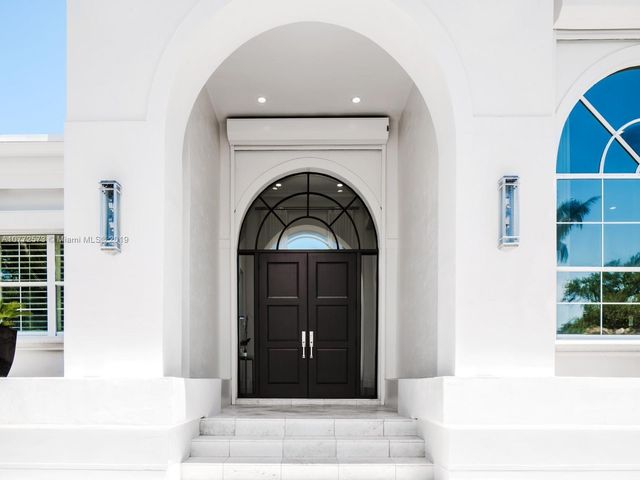 a living room with a fireplace and a window